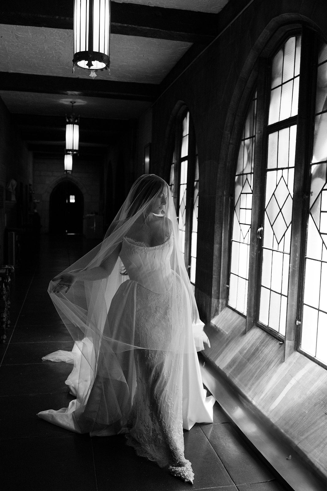 MIRAGE sheer drop veil paired with corset wedding gown.