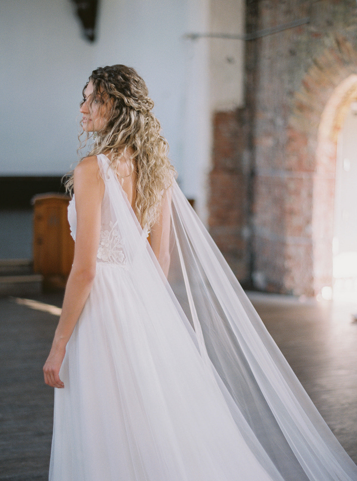 Wedding dress shop with cape veil